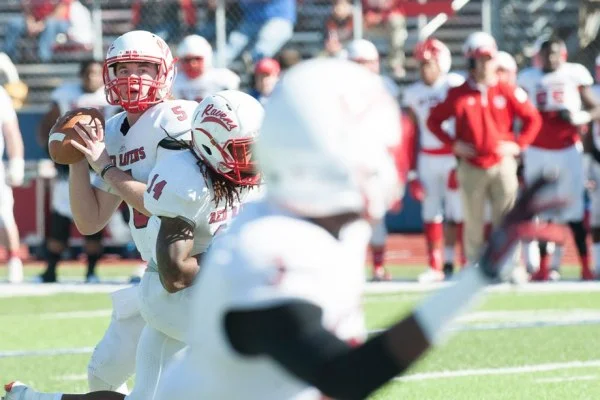 quarterback throwing football